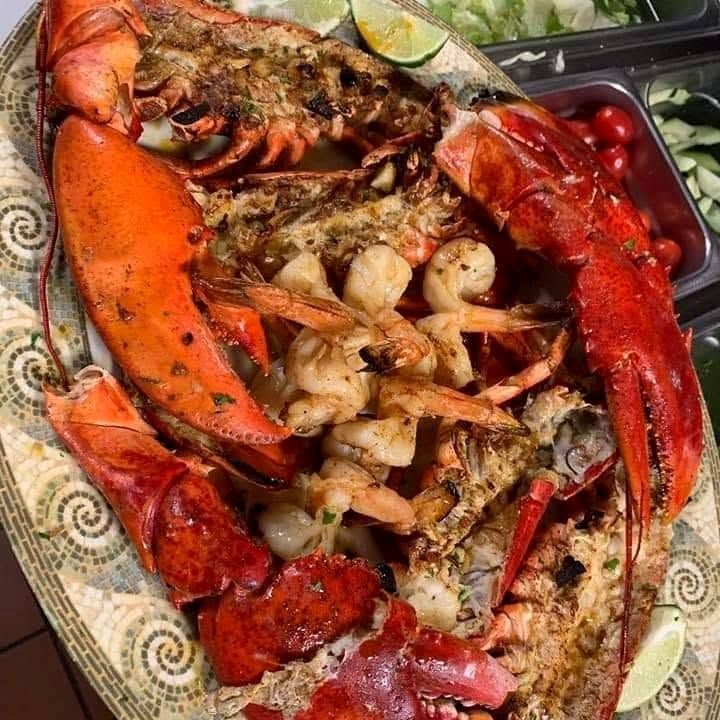 A Flores platter of baked lobster and grilled shrimp