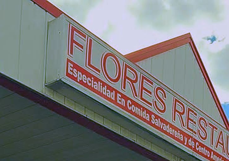 The Flores Restaurant sign on Clarke Street: Especialidad en comida salvadoreña y de Centro América